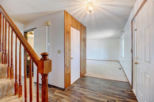 1487 S Zeno Way, Aurora, CO 80017 - entrance foyer with a textured ceiling, wood finished floors, baseboards, and stairway
