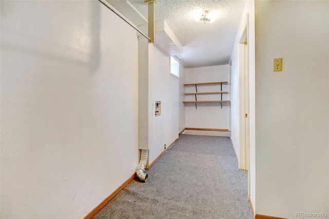 1487 S Zeno Way, Aurora, CO 80017 - hallway with carpet flooring, a textured ceiling, and baseboards