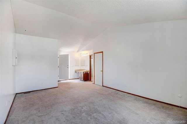 1487 S Zeno Way, Aurora, CO 80017 - unfurnished room featuring vaulted ceiling, carpet floors, and baseboards