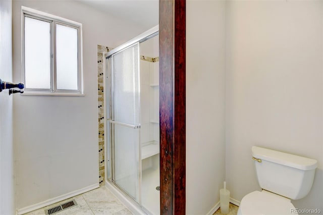 1487 S Zeno Way, Aurora, CO 80017 - full bathroom with baseboards, a stall shower, and toilet