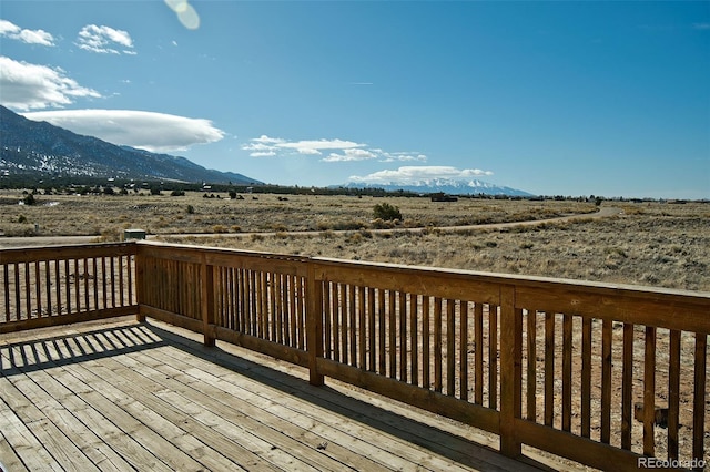 deck featuring a mountain view and a rural view