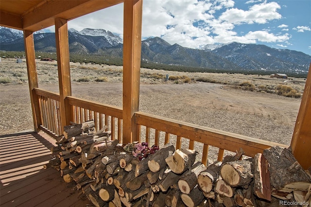 wooden deck with a mountain view