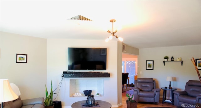 3825 S Monaco Pkwy Unit 111, Denver, CO 80237 - living room with wood finished floors and a fireplace