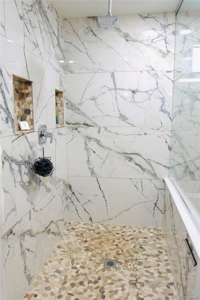 3825 S Monaco Pkwy Unit 111, Denver, CO 80237 - bathroom featuring a marble finish shower
