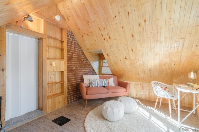 living area with vaulted ceiling, wood-type flooring, wooden ceiling, and wood walls