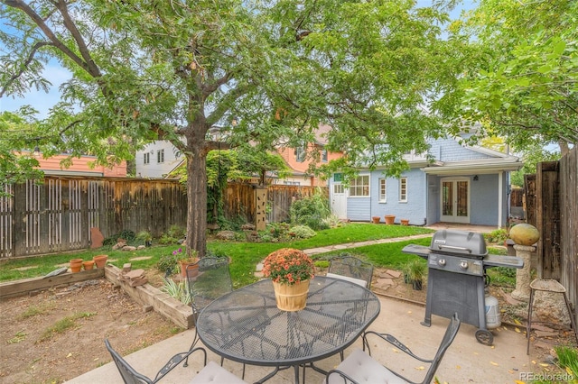 view of patio / terrace with area for grilling and french doors