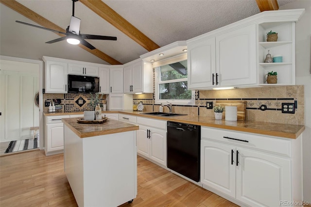 14650 Tejon St, Broomfield, CO 80023 - kitchen featuring black appliances, open shelves, white cabinets, backsplash, and a center island