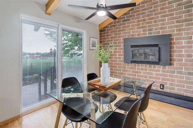 14650 Tejon St, Broomfield, CO 80023 - dining space with wood finished floors, brick wall, a textured ceiling, and ceiling fan