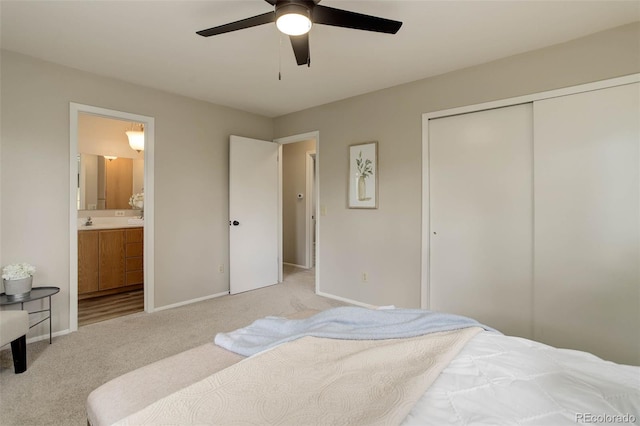 14650 Tejon St, Broomfield, CO 80023 - carpeted bedroom featuring a closet, connected bathroom, baseboards, a sink, and a ceiling fan