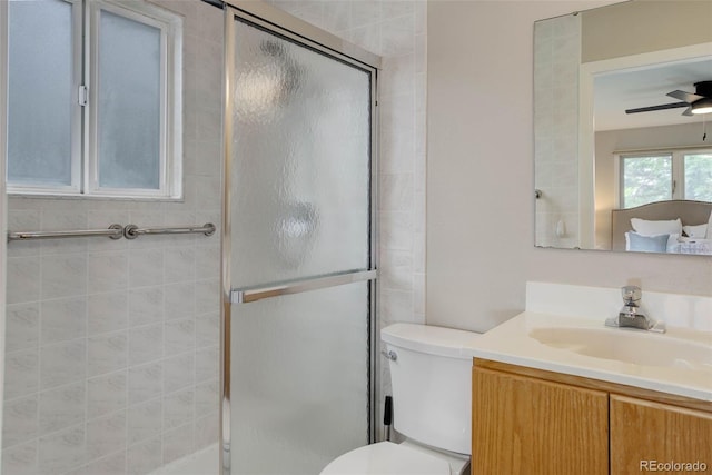 14650 Tejon St, Broomfield, CO 80023 - full bathroom with vanity, toilet, a stall shower, and a ceiling fan