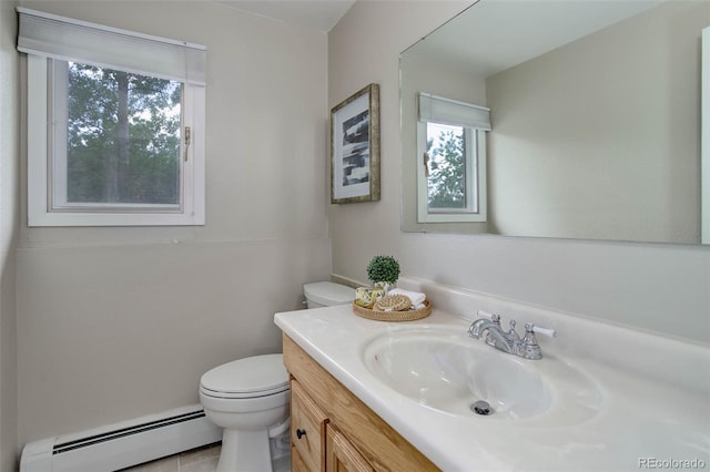 14650 Tejon St, Broomfield, CO 80023 - bathroom featuring baseboard heating, toilet, and vanity
