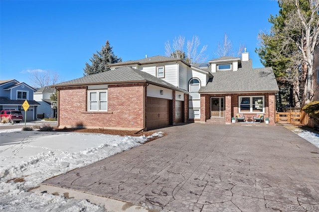 view of front of property with a porch and a garage