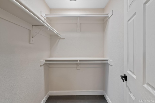 walk in closet featuring tile patterned floors