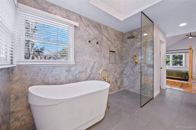 bathroom with tile patterned floors, ceiling fan, and shower with separate bathtub