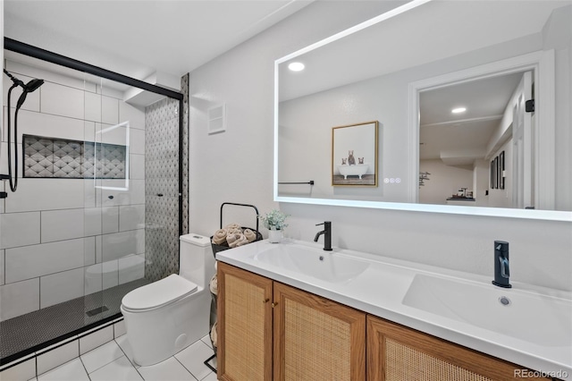 bathroom featuring tile patterned floors, vanity, toilet, and an enclosed shower