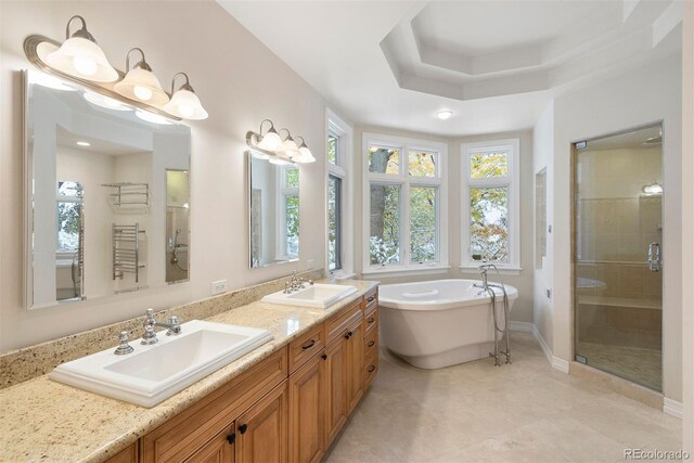 4800 E Cedar Ave, Denver, CO 80246 - full bath featuring a stall shower, a freestanding bath, double vanity, and baseboards