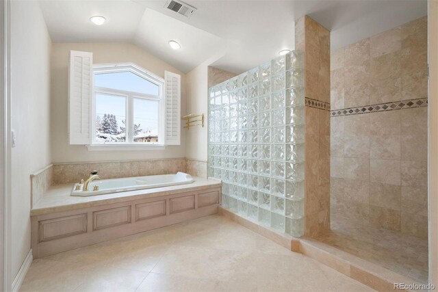 4800 E Cedar Ave, Denver, CO 80246 - bathroom featuring a bath, tile patterned flooring, walk in shower, and lofted ceiling