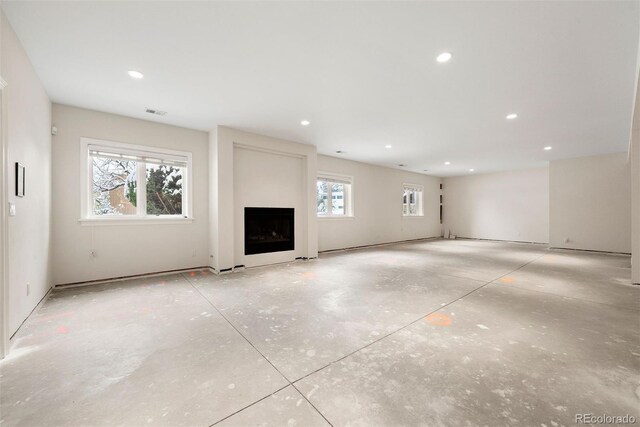 4800 E Cedar Ave, Denver, CO 80246 - unfurnished living room featuring a fireplace and recessed lighting