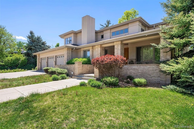 4800 E Cedar Ave, Denver, CO 80246 - prairie-style home with driveway, brick siding, an attached garage, a front yard, and a chimney