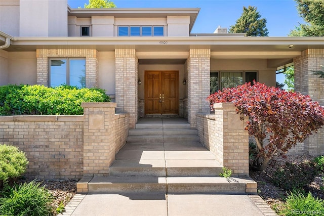 4800 E Cedar Ave, Denver, CO 80246 - view of exterior entry with brick siding and stucco siding