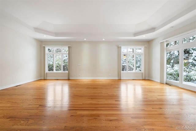 4800 E Cedar Ave, Denver, CO 80246 - empty room with a raised ceiling, light wood-style floors, recessed lighting, and baseboards