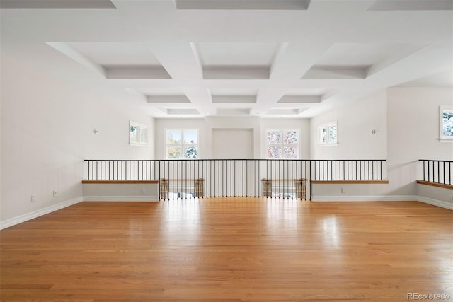 4800 E Cedar Ave, Denver, CO 80246 - spare room featuring coffered ceiling, light wood-style floors, beamed ceiling, and baseboards