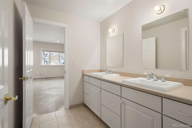 4800 E Cedar Ave, Denver, CO 80246 - bathroom with tile patterned flooring, double vanity, and baseboards