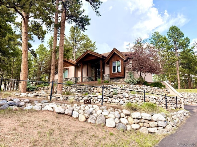 185 Wildrose Ct, Woodland Park, CO 80863 - view of front facade with stucco siding and stone siding
