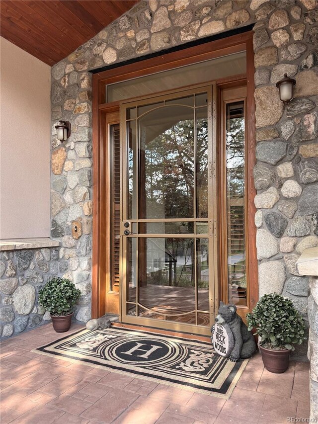 185 Wildrose Ct, Woodland Park, CO 80863 - property entrance featuring stone siding