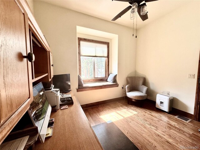 185 Wildrose Ct, Woodland Park, CO 80863 - living area featuring wood finished floors and a ceiling fan