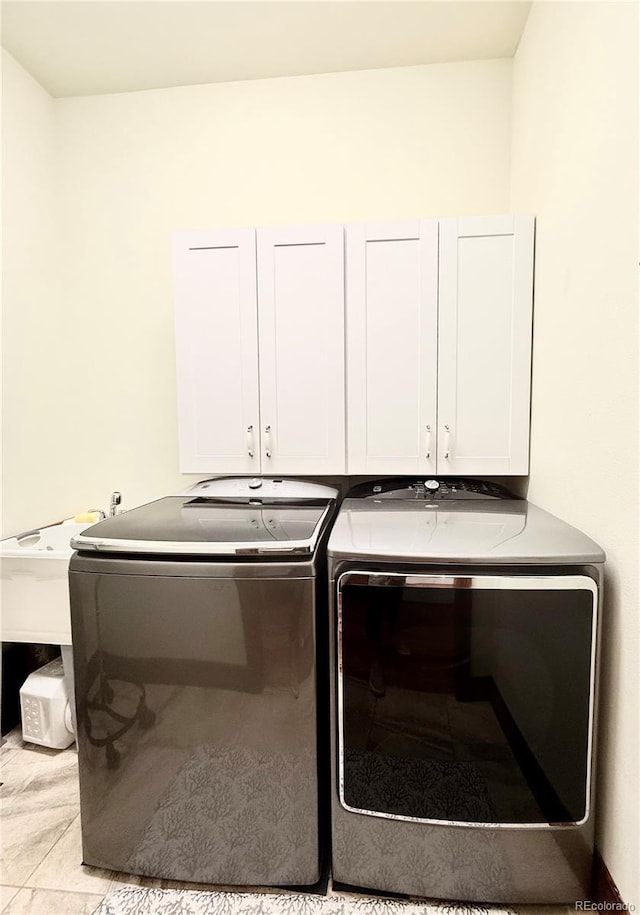 185 Wildrose Ct, Woodland Park, CO 80863 - washroom featuring cabinet space and washing machine and clothes dryer