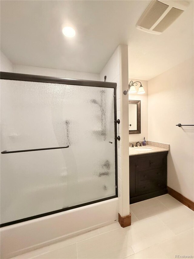 185 Wildrose Ct, Woodland Park, CO 80863 - full bathroom with combined bath / shower with glass door, vanity, and tile patterned floors