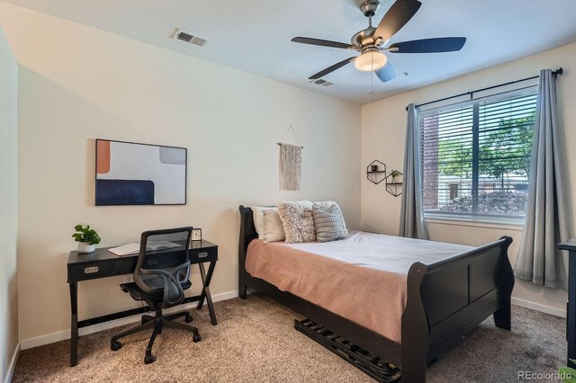 4100 Albion St Unit 611, Denver, CO 80216 - carpeted bedroom featuring a desk and a ceiling fan
