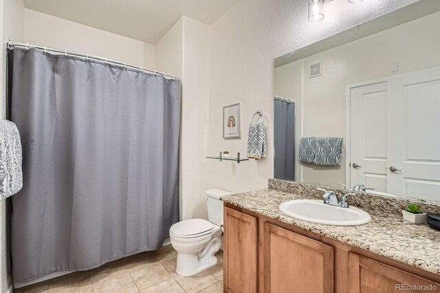 4100 Albion St Unit 611, Denver, CO 80216 - bathroom with vanity and tile patterned flooring