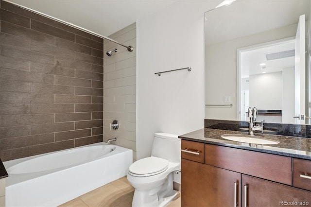 full bathroom with toilet, vanity, tiled shower / bath combo, and tile patterned floors