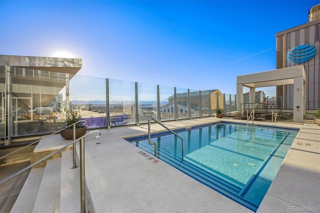 view of swimming pool with a patio