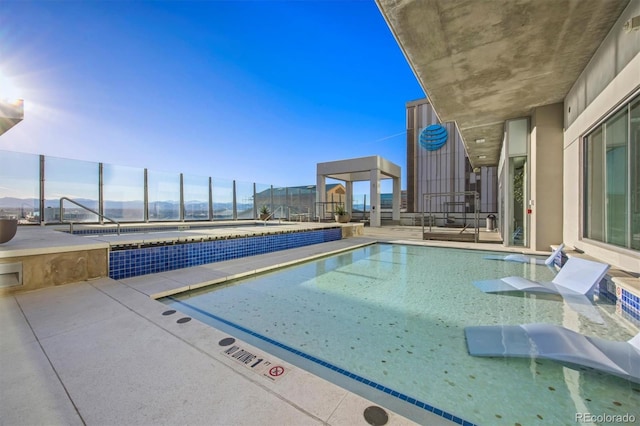 view of swimming pool featuring a patio area