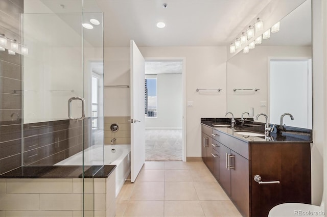 bathroom with separate shower and tub, tile patterned flooring, and vanity