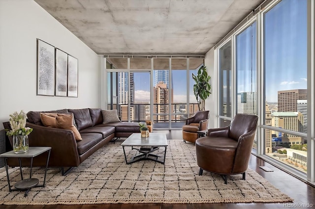 living room with hardwood / wood-style floors and expansive windows