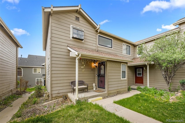 1061 S Yampa St Unit C, Aurora, CO 80017 - view of front of property featuring a shingled roof