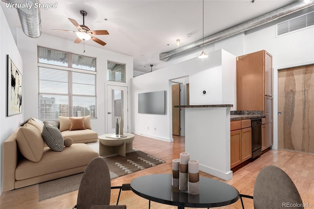 7700 E 29th Ave Unit 405, Denver, CO 80238 - living area featuring light wood-style floors and a ceiling fan