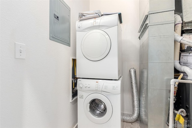7700 E 29th Ave Unit 405, Denver, CO 80238 - washroom featuring stacked washing machine and dryer and electric panel