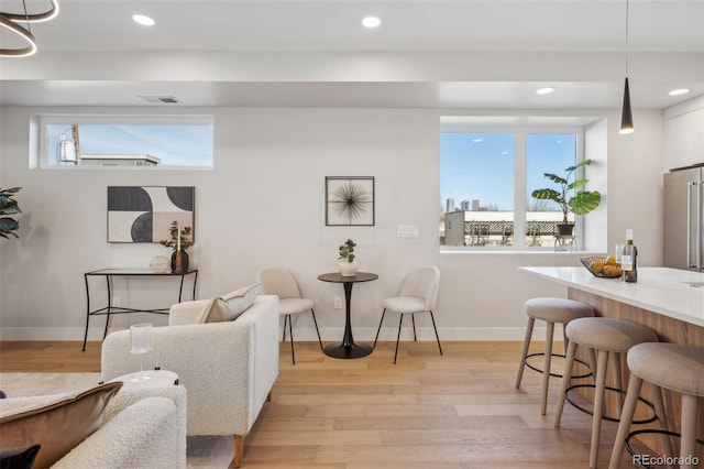2330 Eliot St Unit 7, Denver, CO 80211 - living room with recessed lighting, visible vents, light wood-style flooring, and baseboards