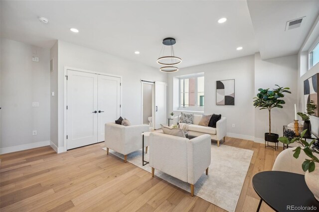 2330 Eliot St Unit 7, Denver, CO 80211 - living room with recessed lighting, visible vents, light wood-style flooring, and baseboards