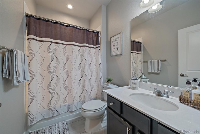 bathroom with vanity, toilet, a shower with curtain, and tile patterned flooring