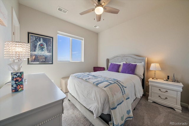 carpeted bedroom with a ceiling fan and visible vents