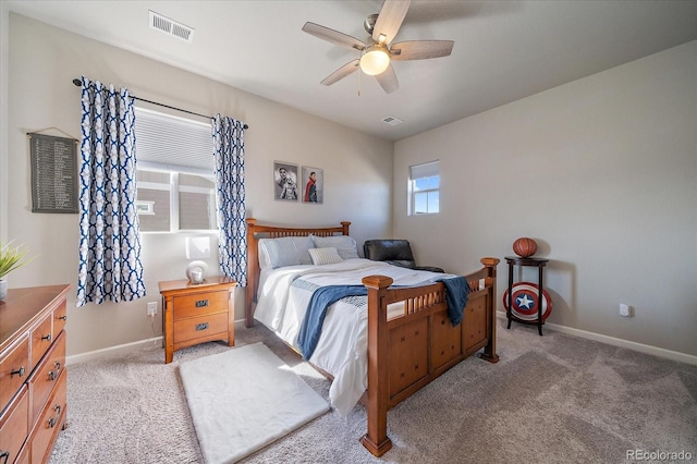 bedroom with visible vents, baseboards, and carpet