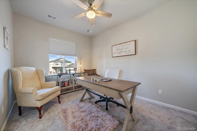 carpeted office with visible vents, baseboards, and ceiling fan