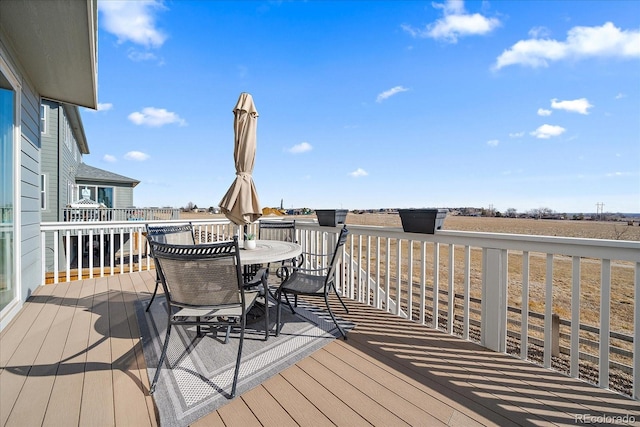 wooden deck with outdoor dining area