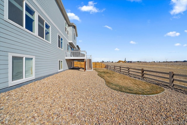 view of yard featuring stairs and a fenced backyard